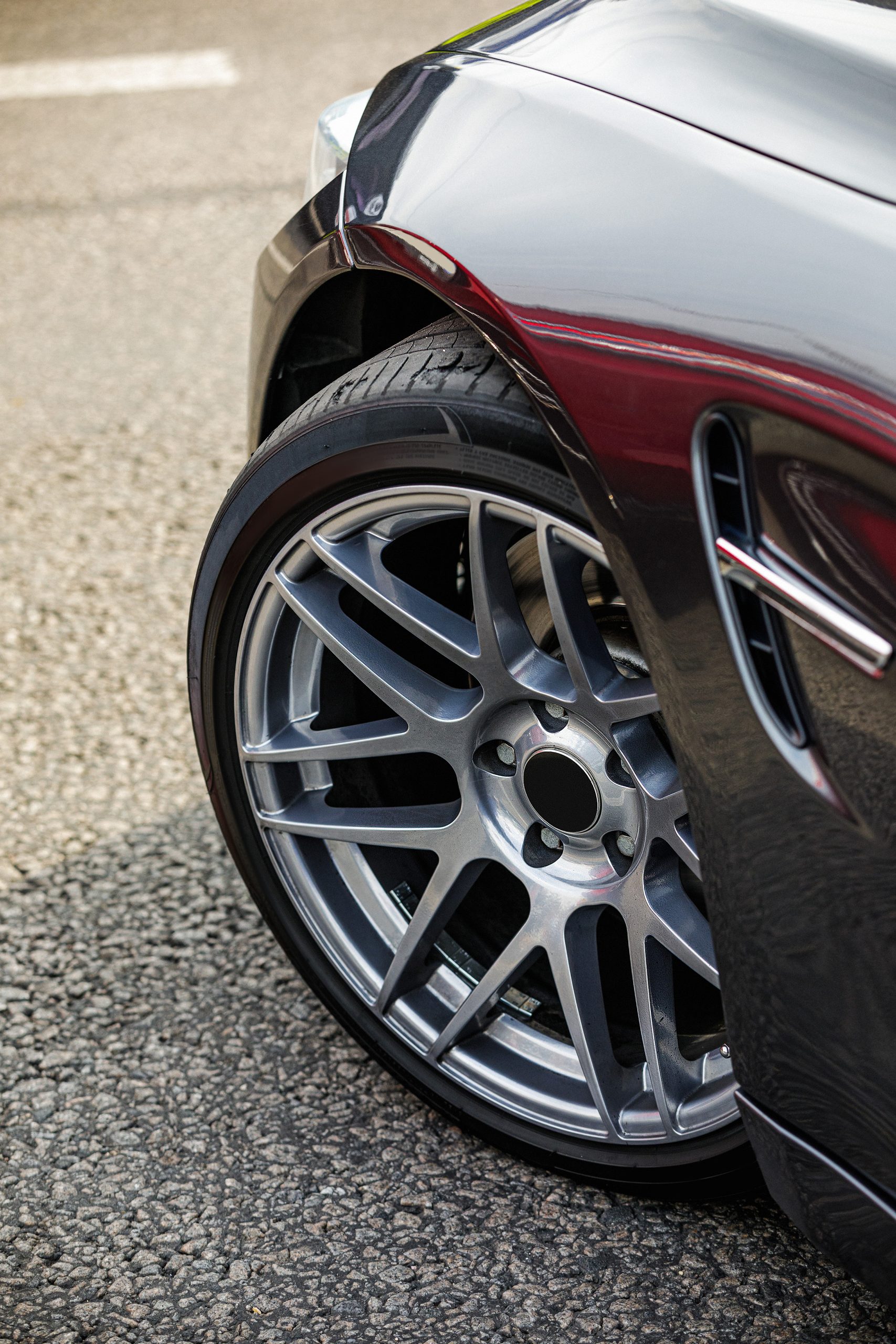 detail of car. front car wheel on the asphalt road